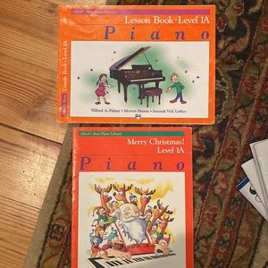 - Alfred’s Basic Piano Library  lesson book Level 1A